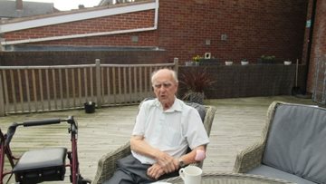 Birmingham care home Resident reminisces in the sunshine